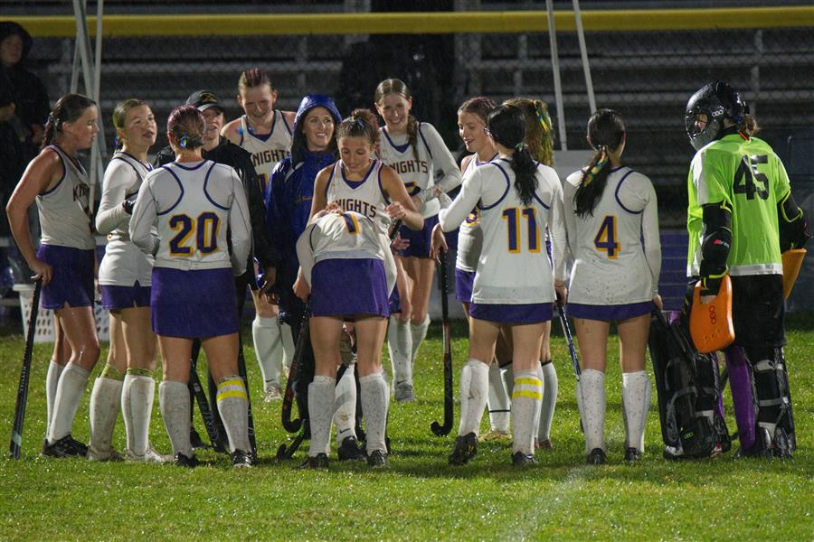 Varsity Field Hockey Team Members Huddle